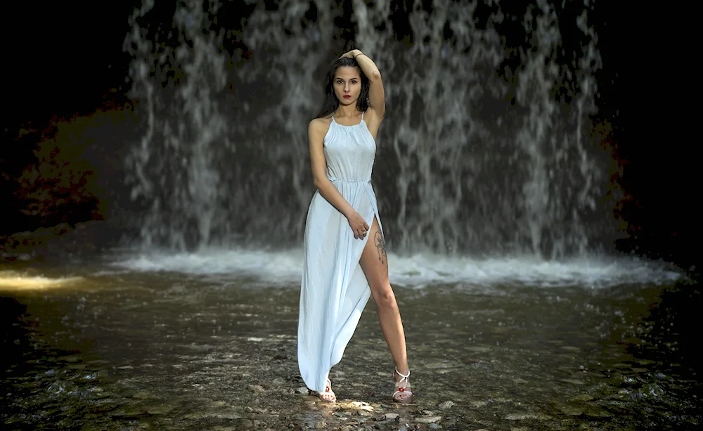 Waterfall girl at the waterfall. waterfall