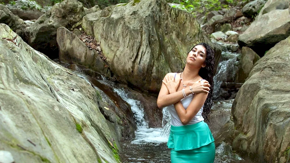 Girl in a mountain river