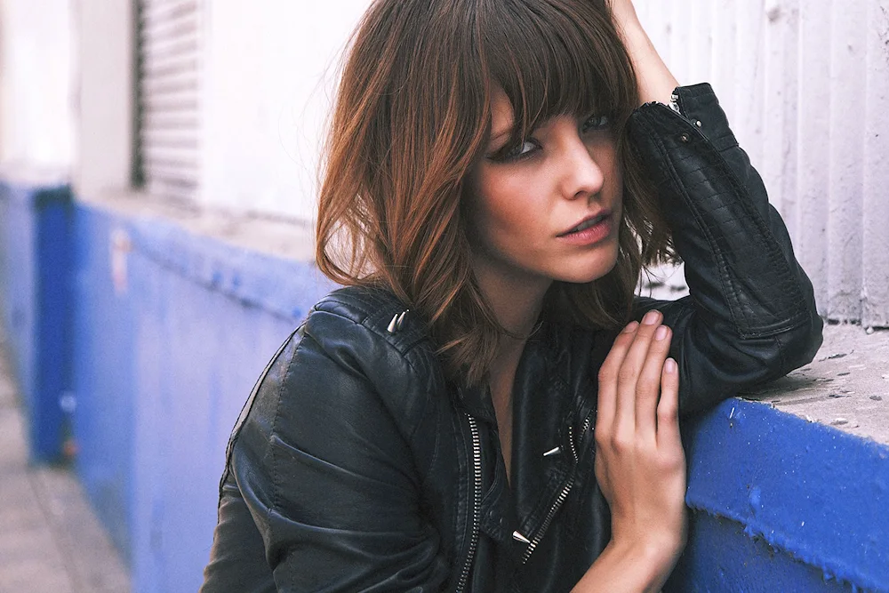 Girl with a bob in a leather jacket