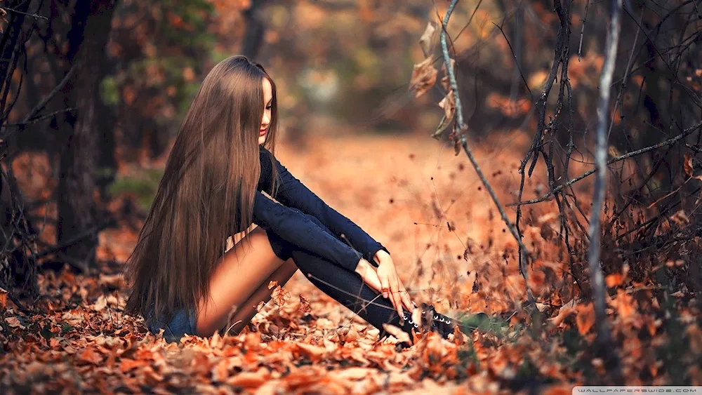 Autumn girl in the forest