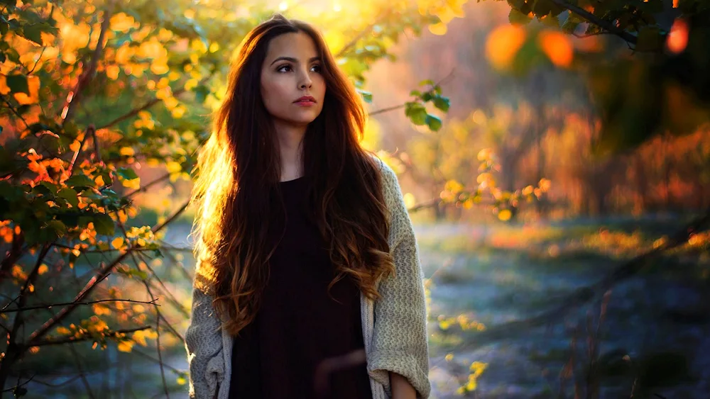 Girl in autumn forest