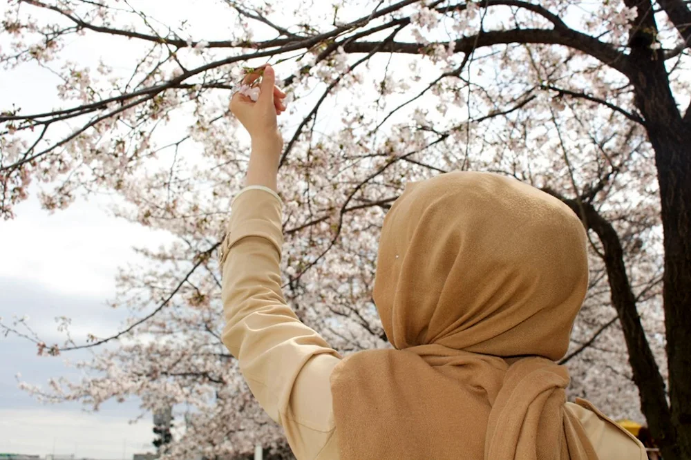 Kasumova. wearing a headscarf from the back