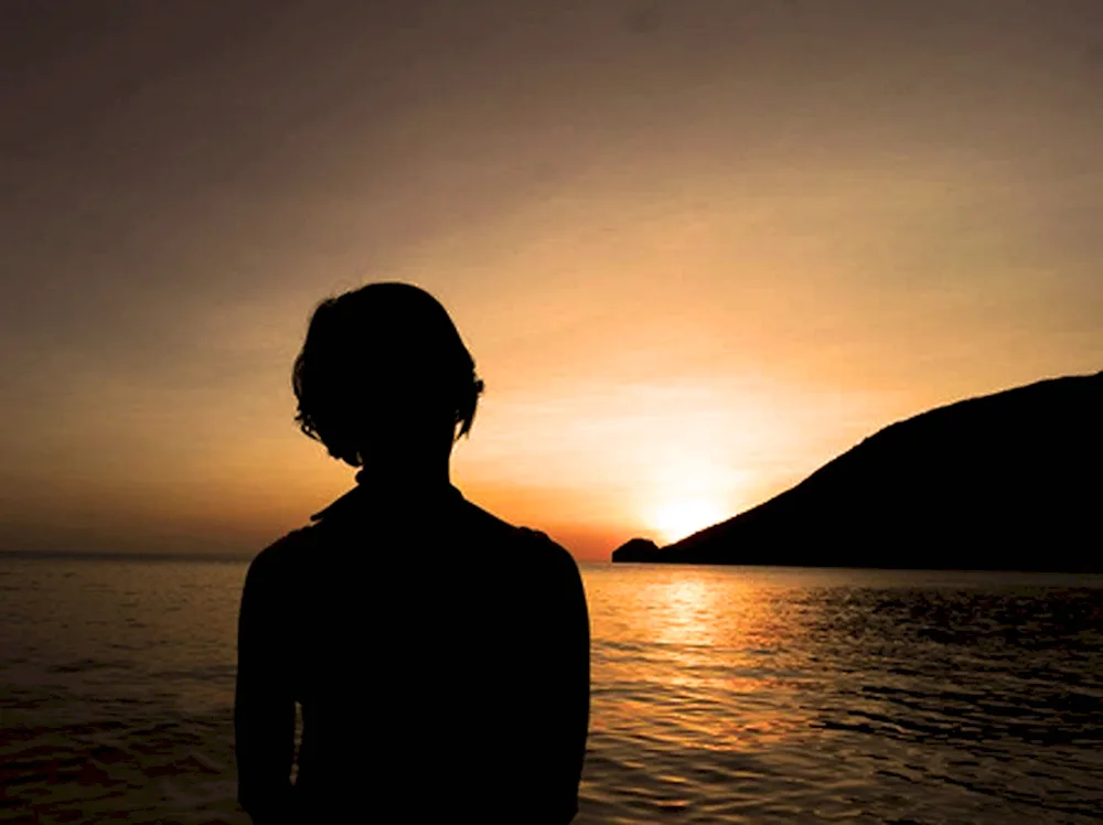 Girl in a sunset from back with short hair