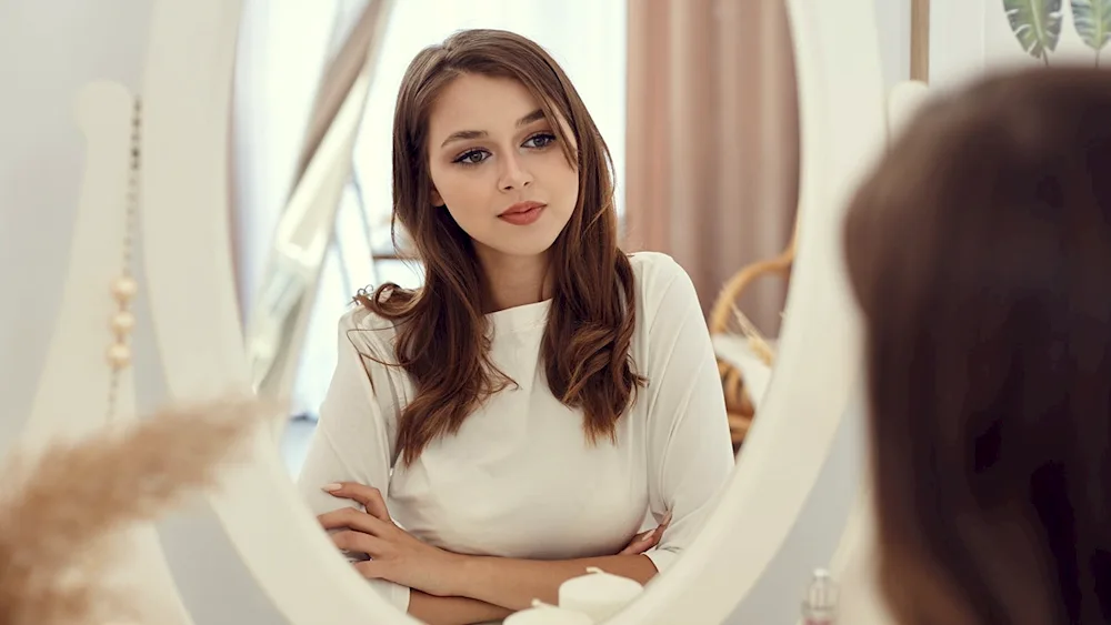 Girl in the mirror near the mirror