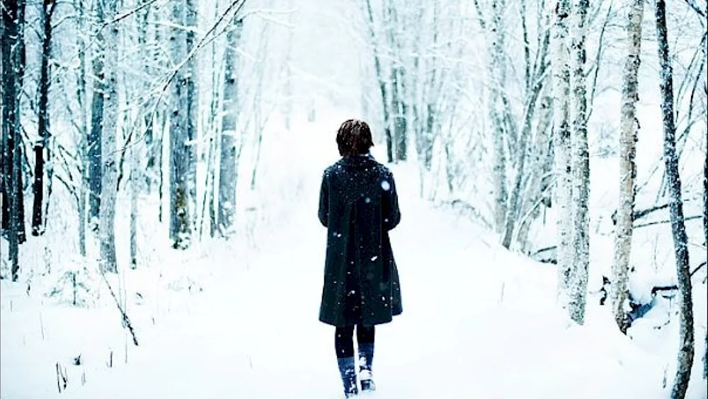 Winter girl in the forest in winter