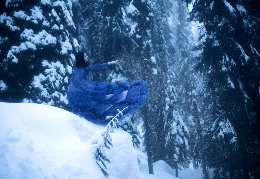 Girl in winter in snowdrift