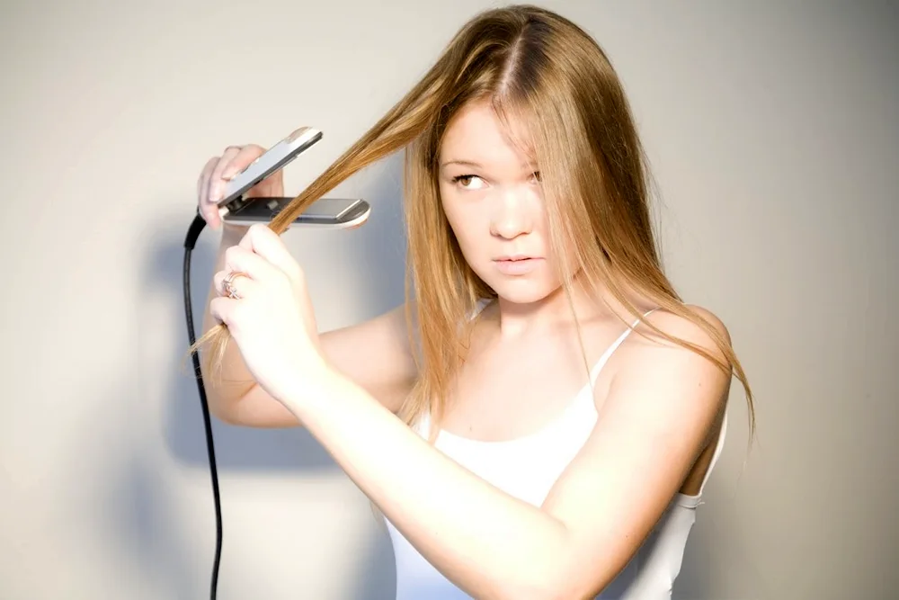 Girl straightens hair