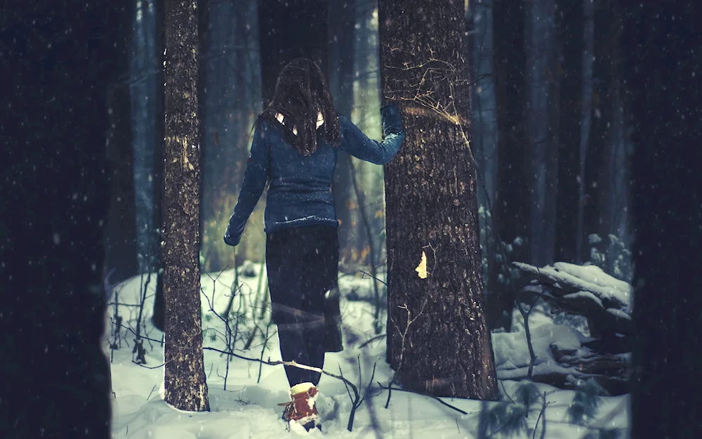 Winter girl in the forest in winter