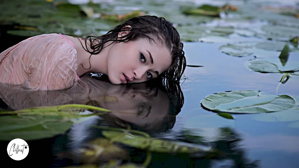 Girl by the lake river