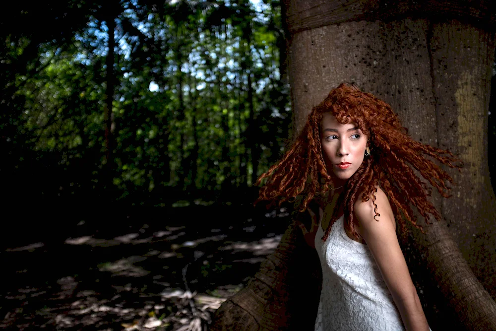 Girl with curly hair from the nature