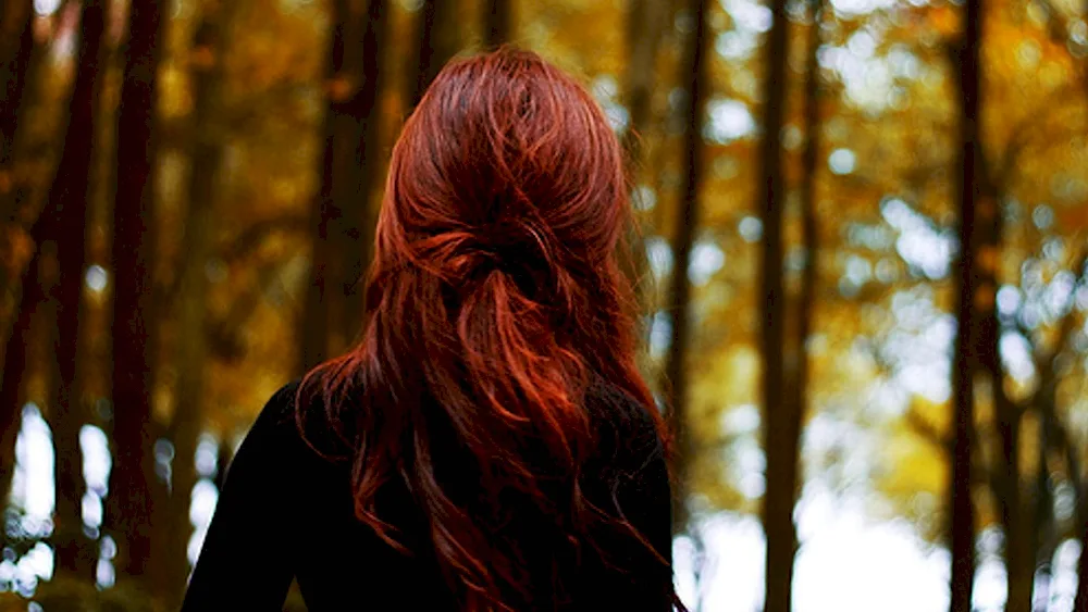 Girl in autumn forest