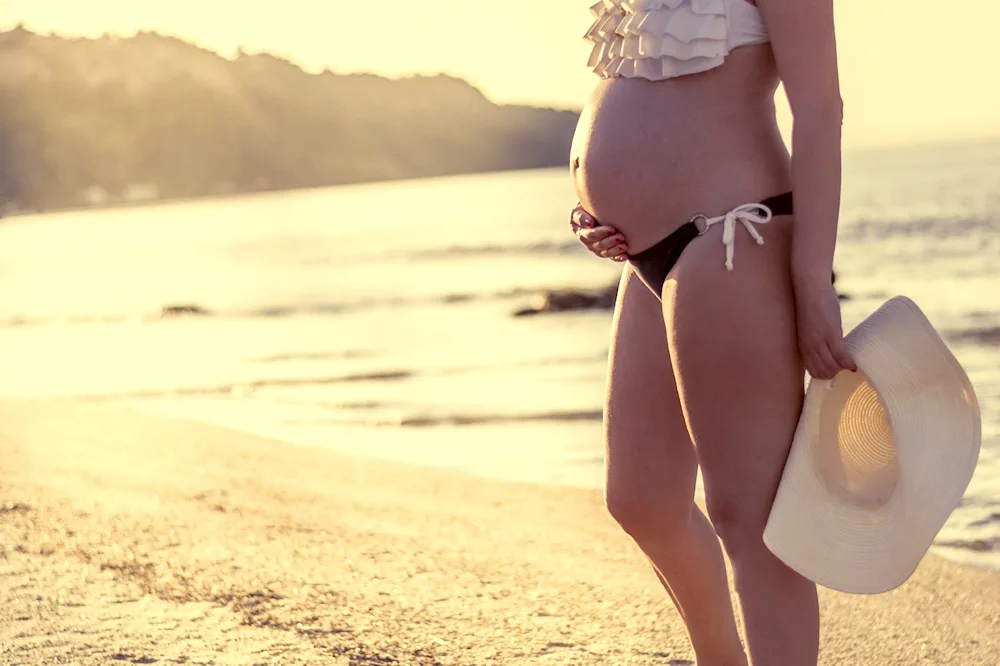 Pregnant girl on the sea