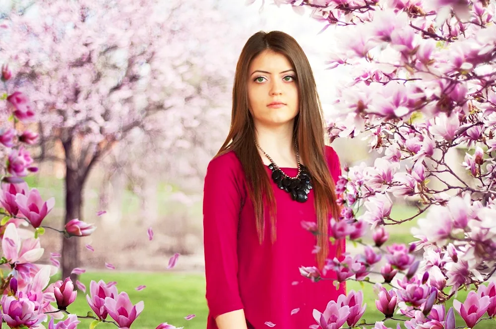 Girl in a blossoming garden