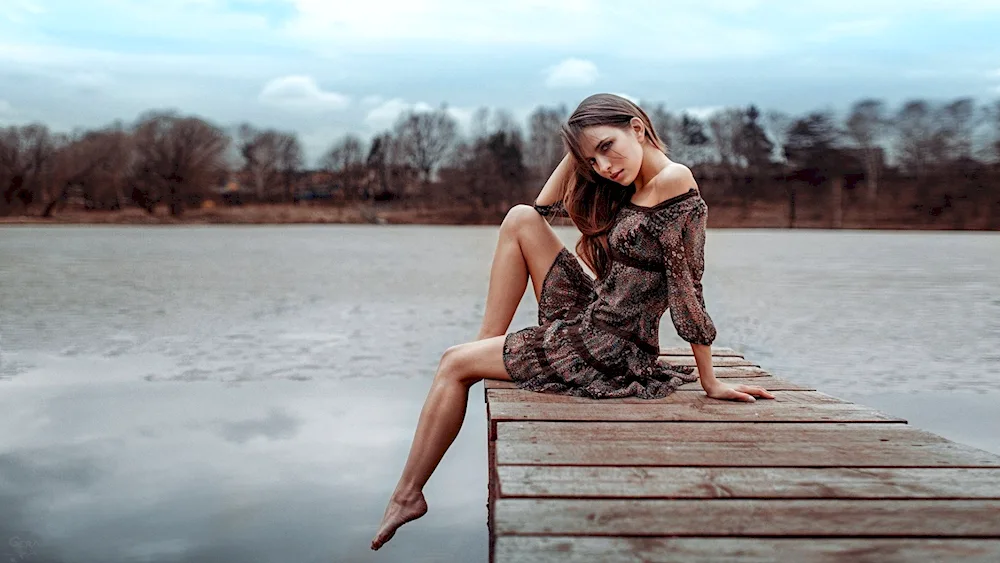 Redheaded girl on the seashore