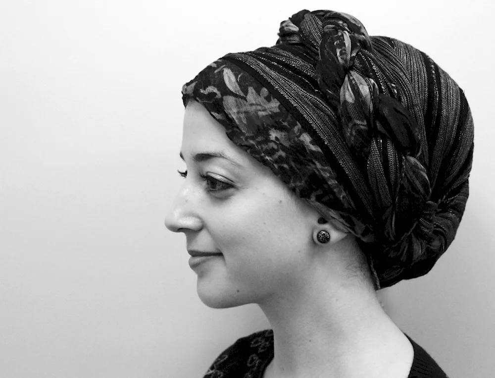 Woman in the temple wearing a headscarf