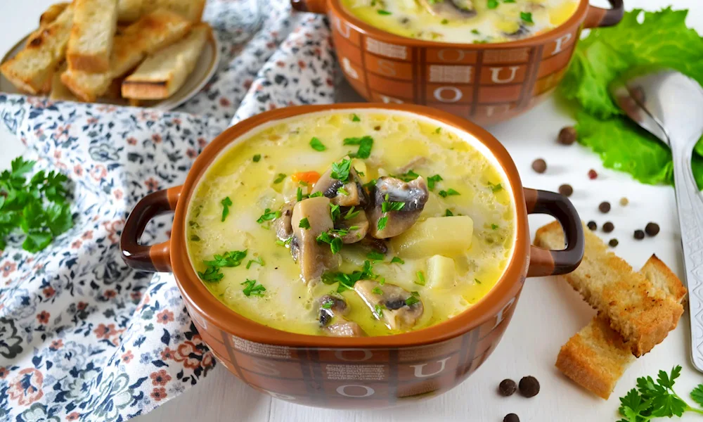 Mushroom soup with melted cheese