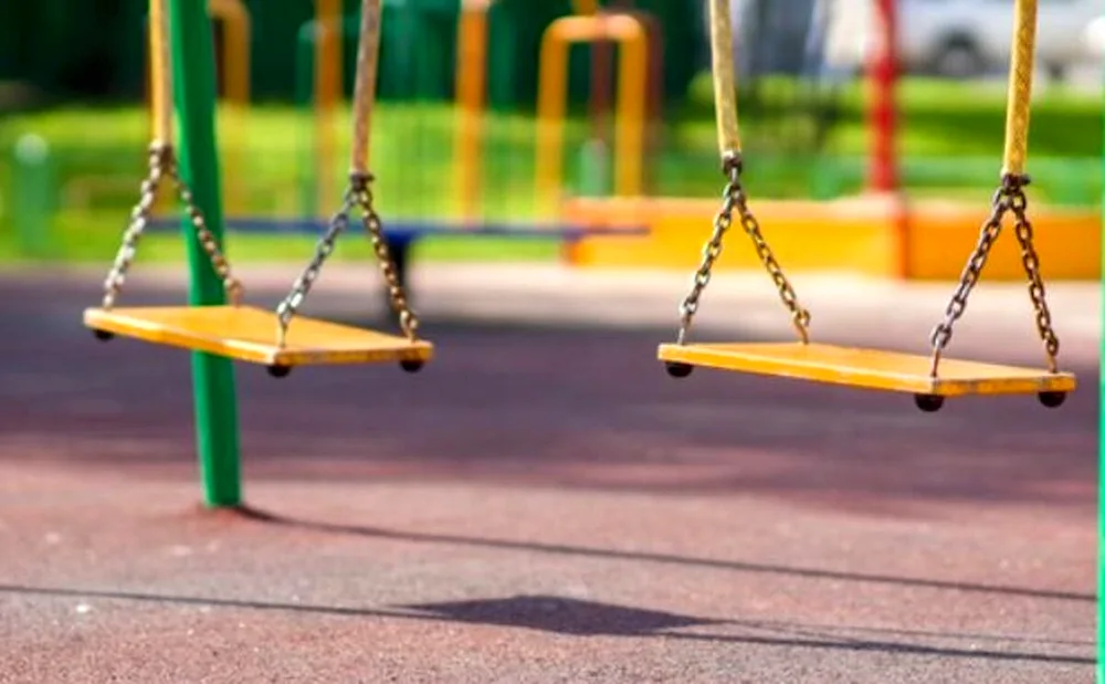 Swinging on the playground square