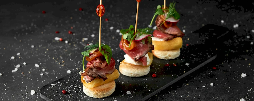 Canape with salami and olives