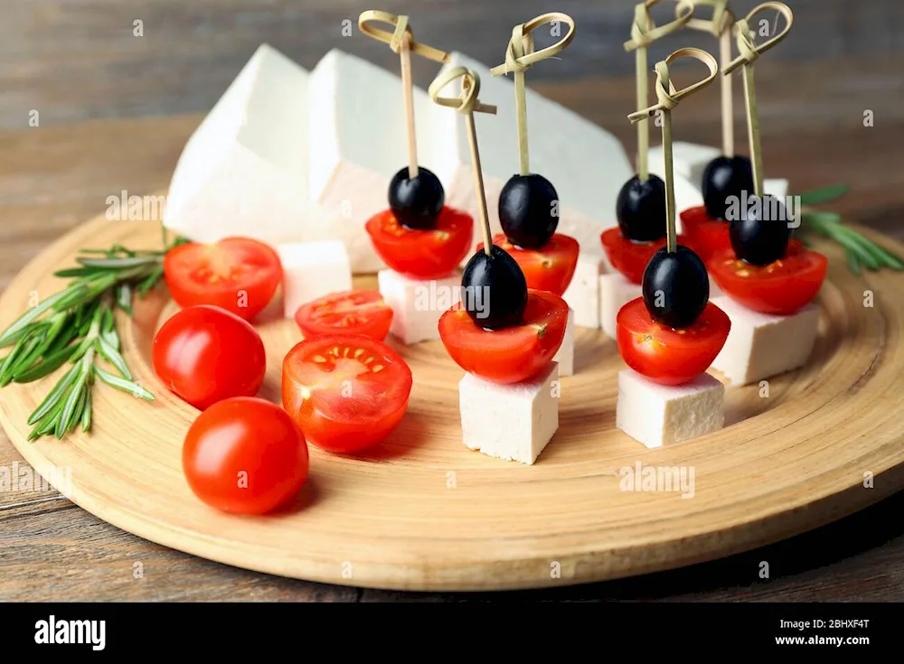 Kanape mozzarella with cherry and basil