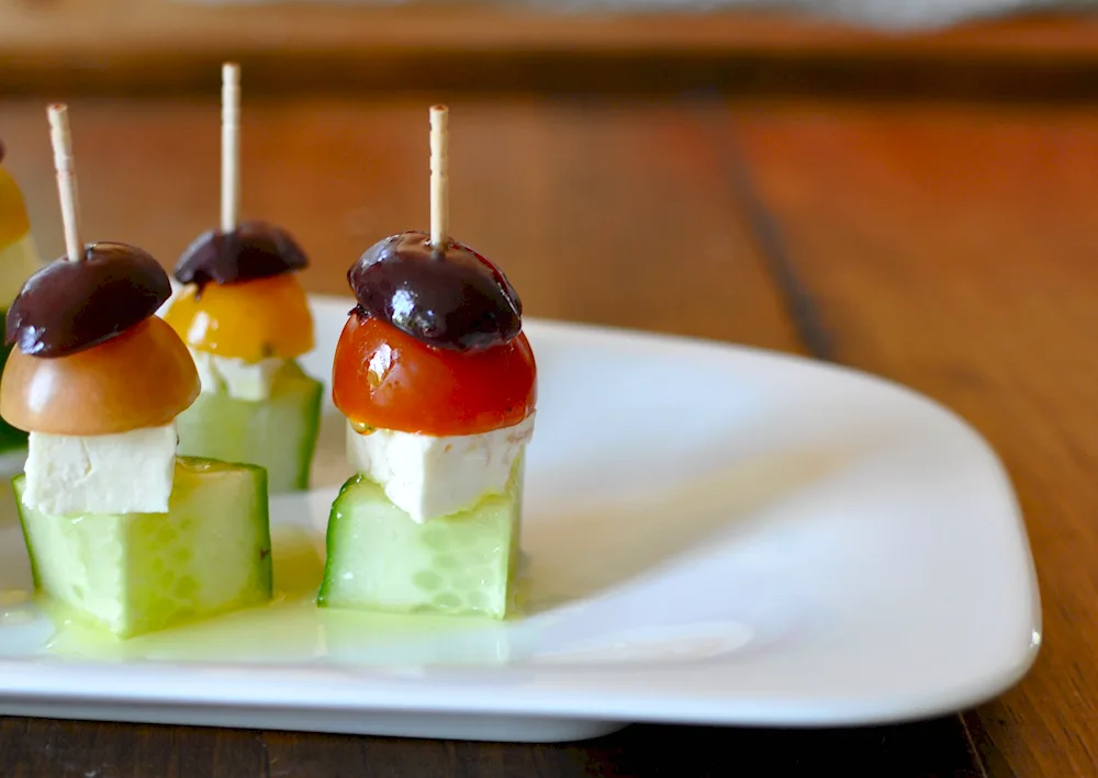 Kanape mozzarella with cherry and basil