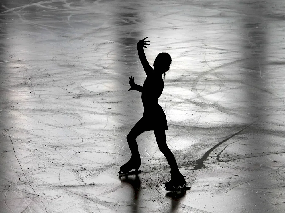 Figure skating on dark background