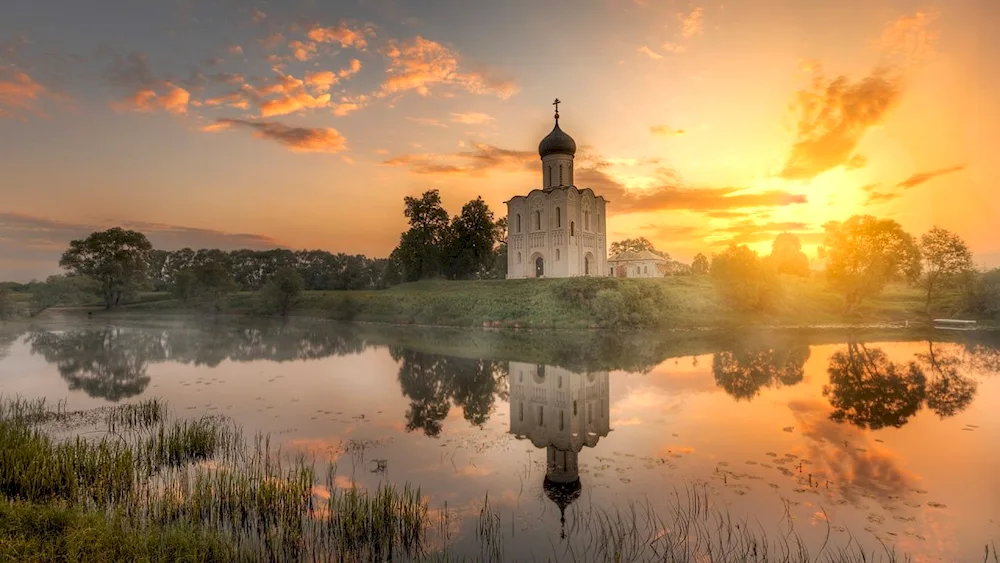 The Church of the Intercession of the Intercession on Nerli dawns. Vvedensky Monastery on the Tolga River