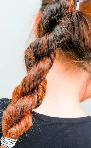 A ponytail with a braided ponytail dragon. Viking braids