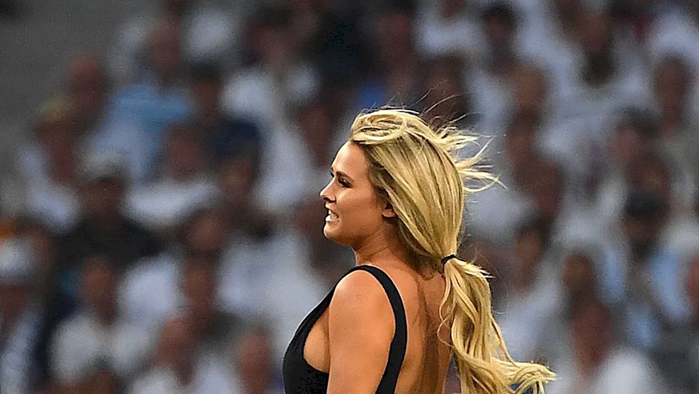 Kinsey Wolanski on the pitch Wolanski at the Champions League final