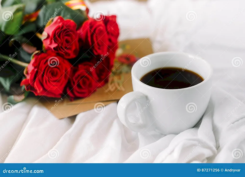 Coffee and roses in bed