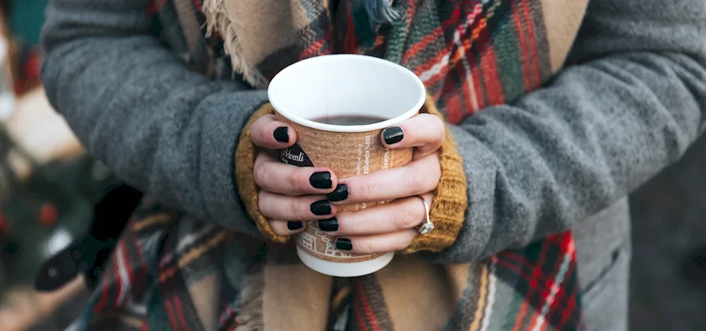 Cup of coffee in hand Aesthetica