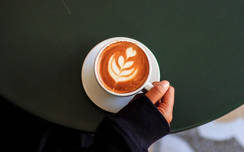 Girl drinking coffee in hand