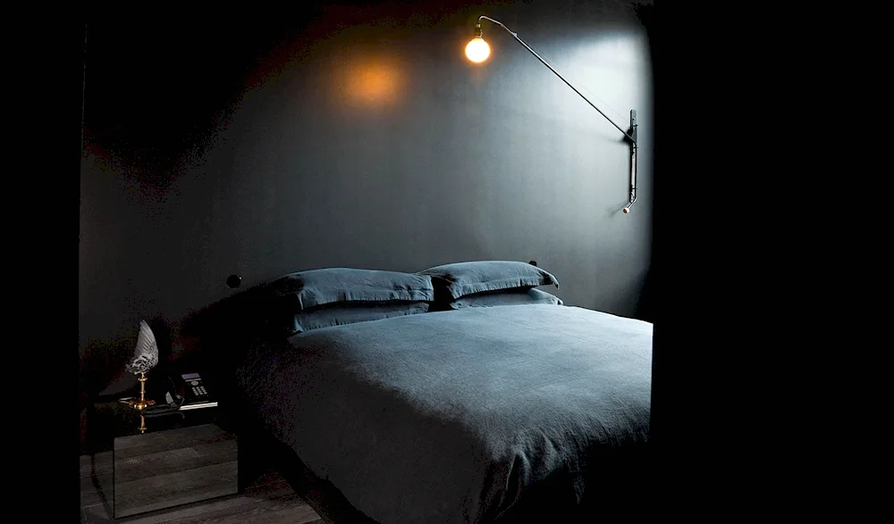 A room with a bed at night