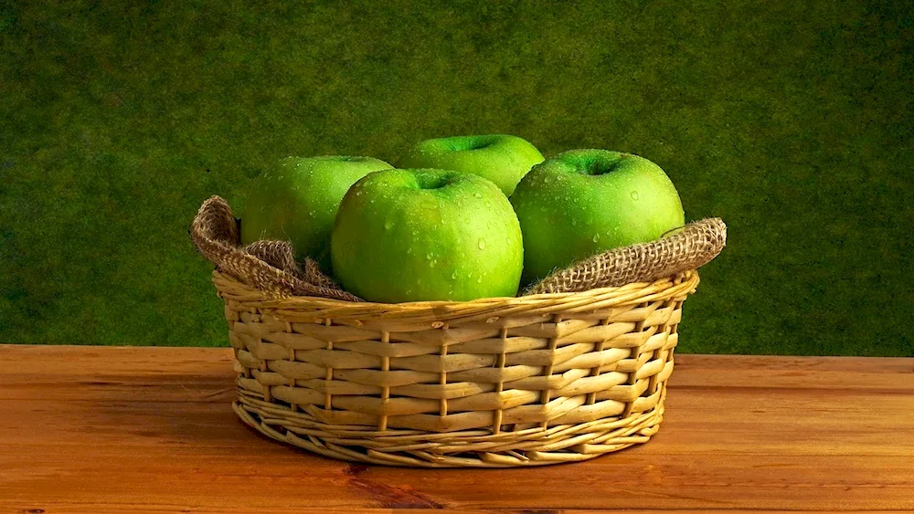 Basket with green apples