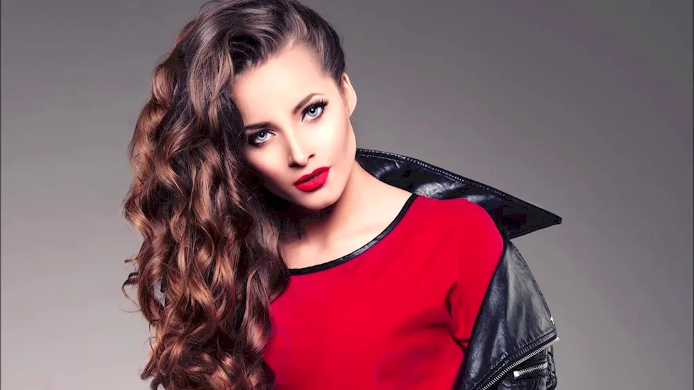 Beautiful girl with curly hair and red lips