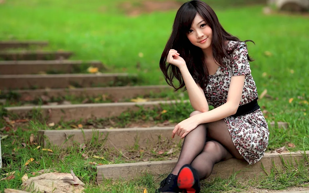 Girl sitting in white dress