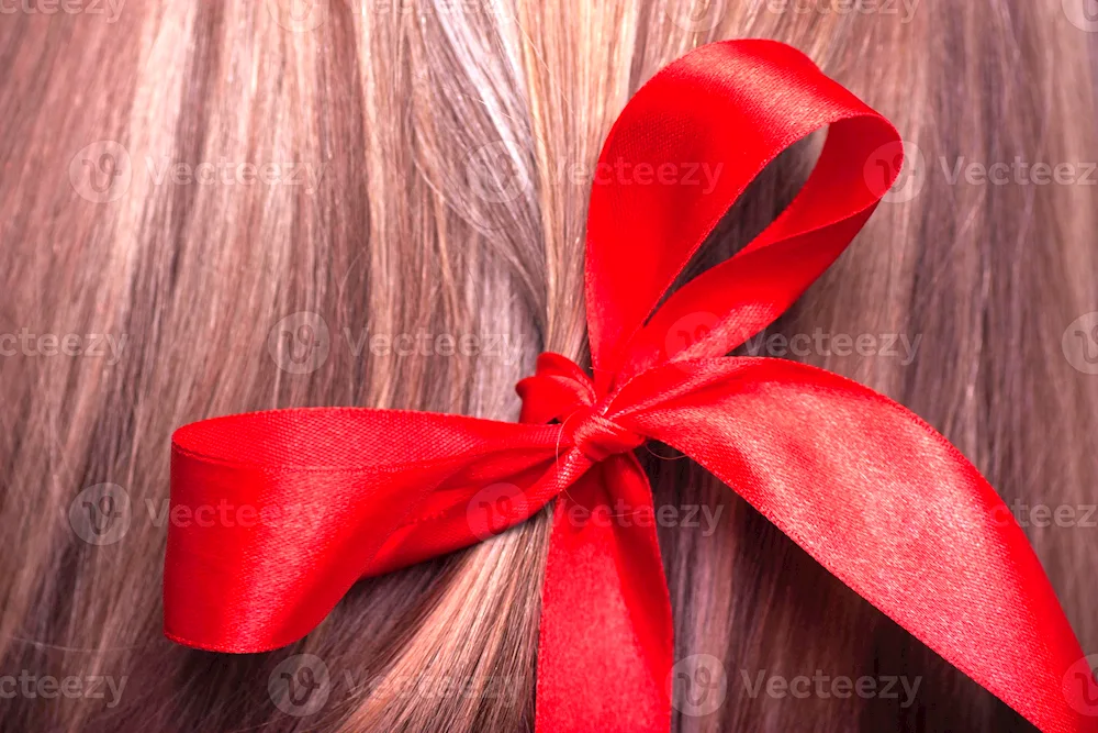 Red ribbon in her hair