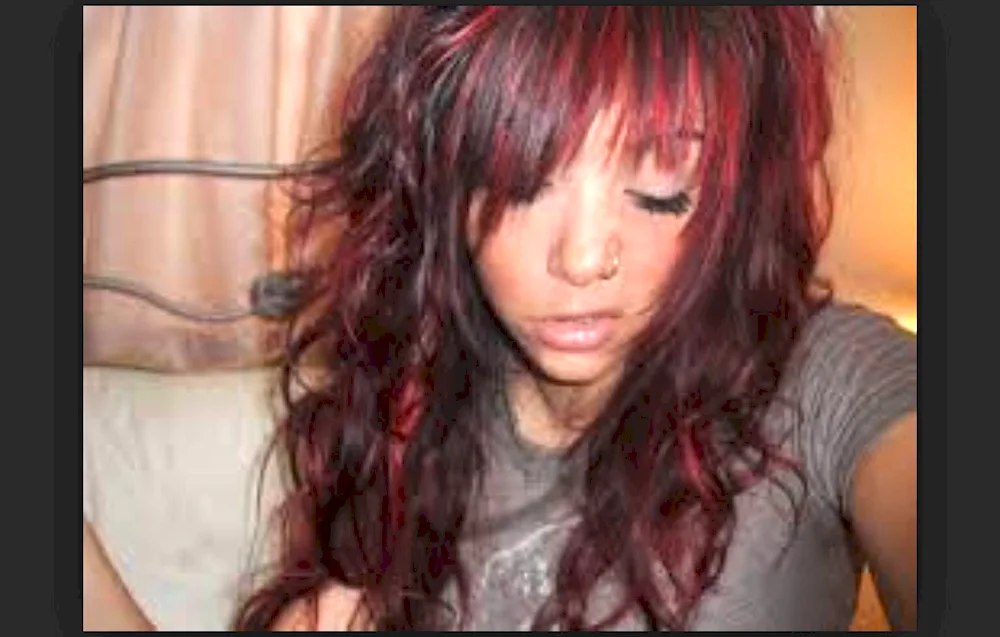 Red strands on dark hair