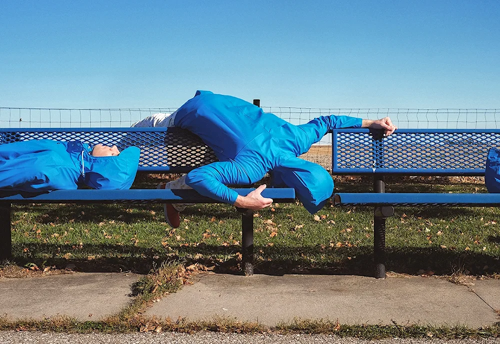 Businessman lying on the grass