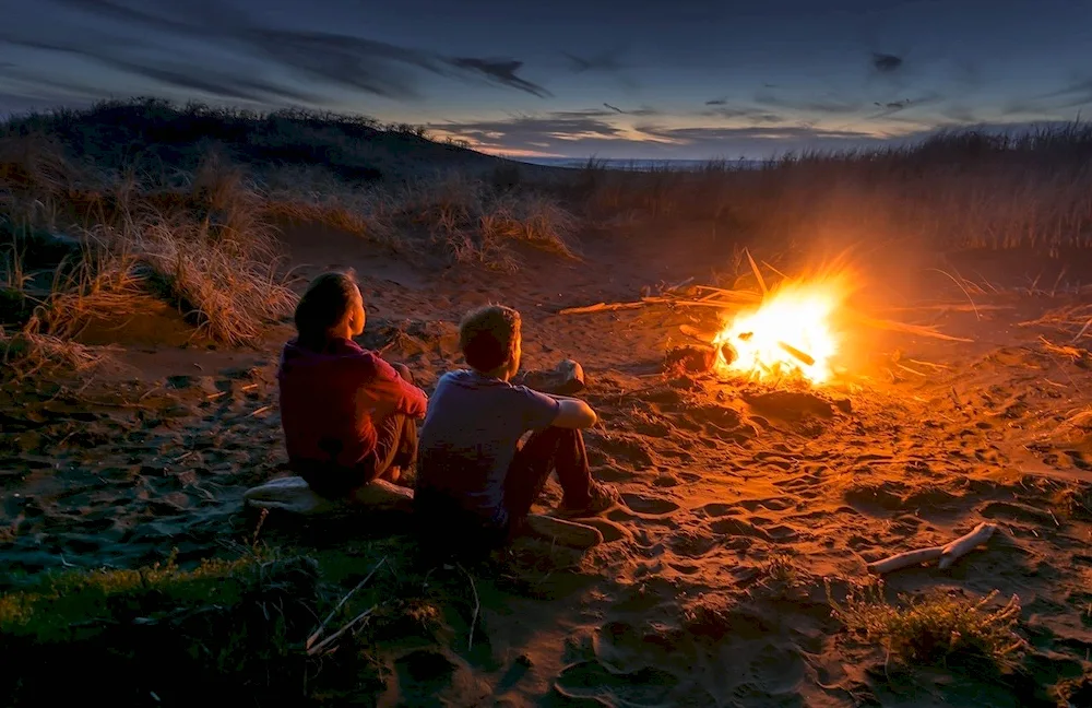 Girl around the campfire