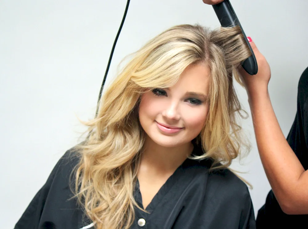 Middle hair curls with a flat iron