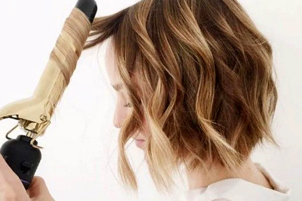 Break curls on bob with iron