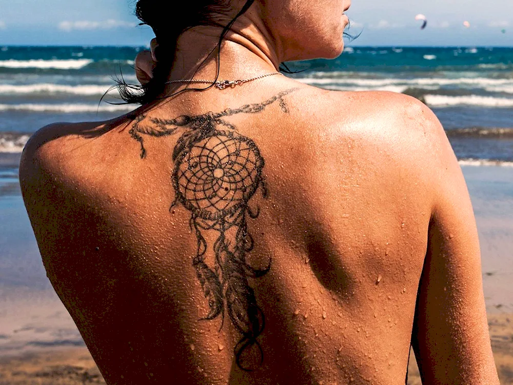 Dream catcher tattoo on back