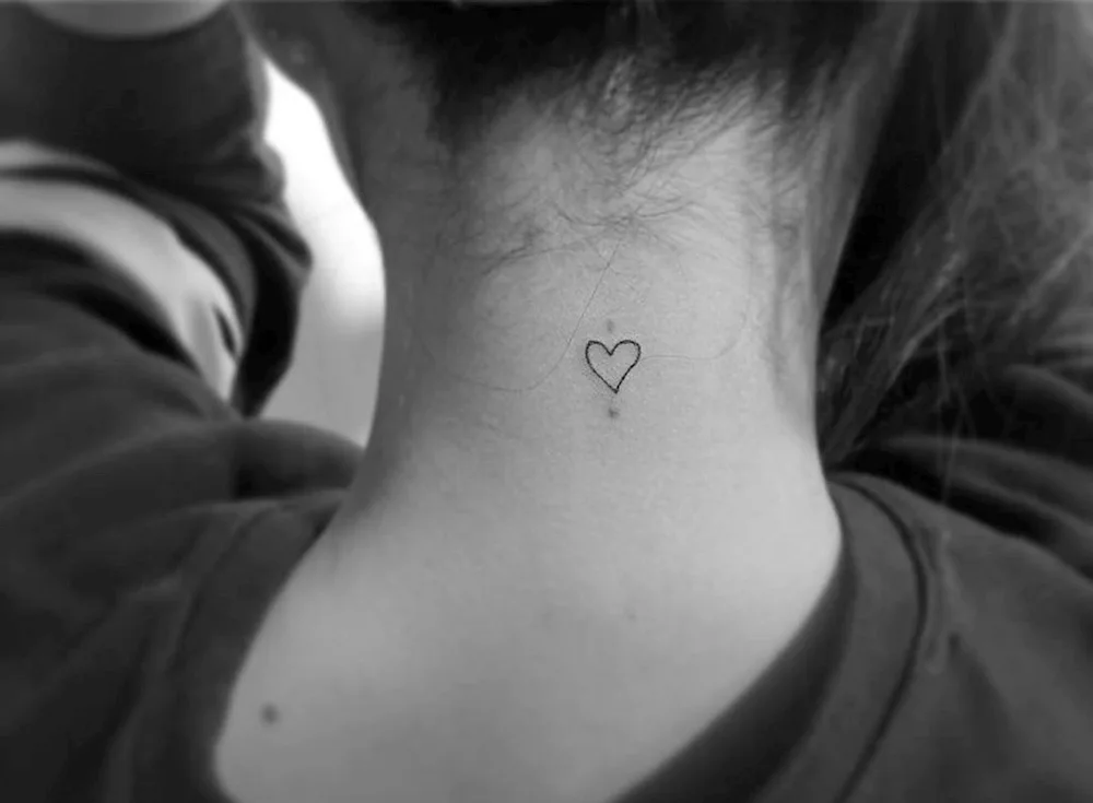 Small collarbone tattoo