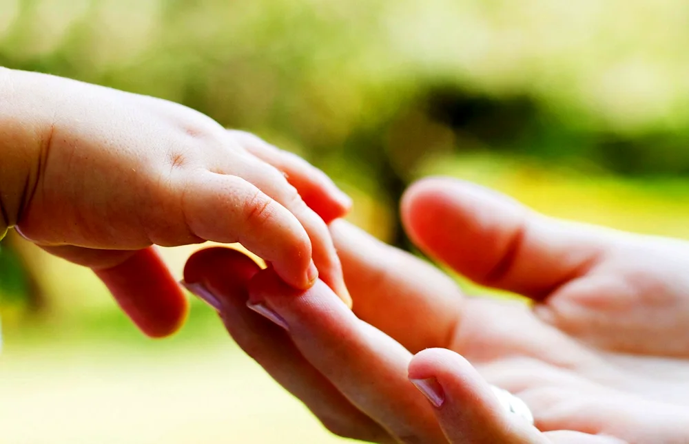 Baby hands with baby in hands