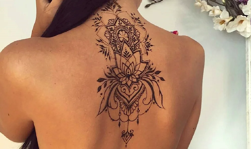 Lotus mandala tattoo on back