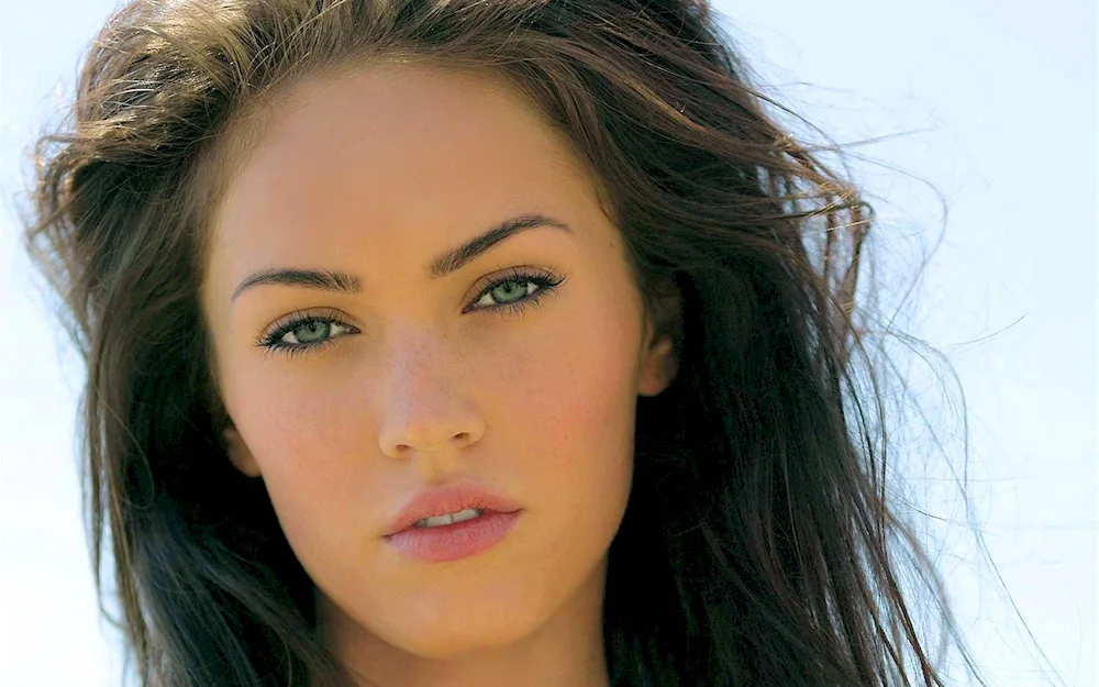 Megan Fox with green eyes.