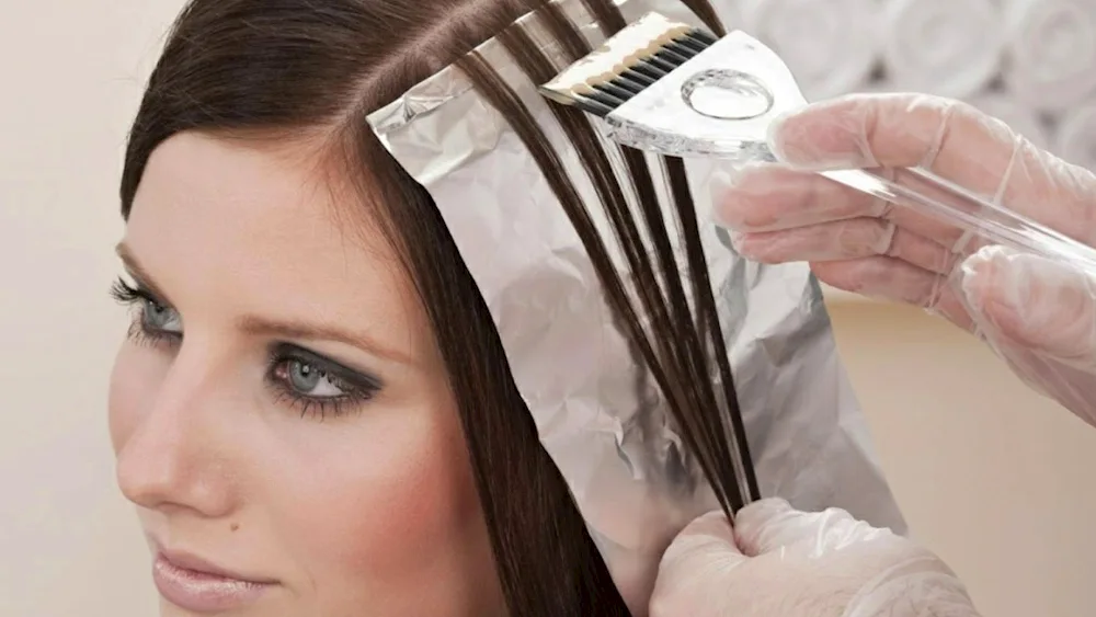 Hair colouring through a cap