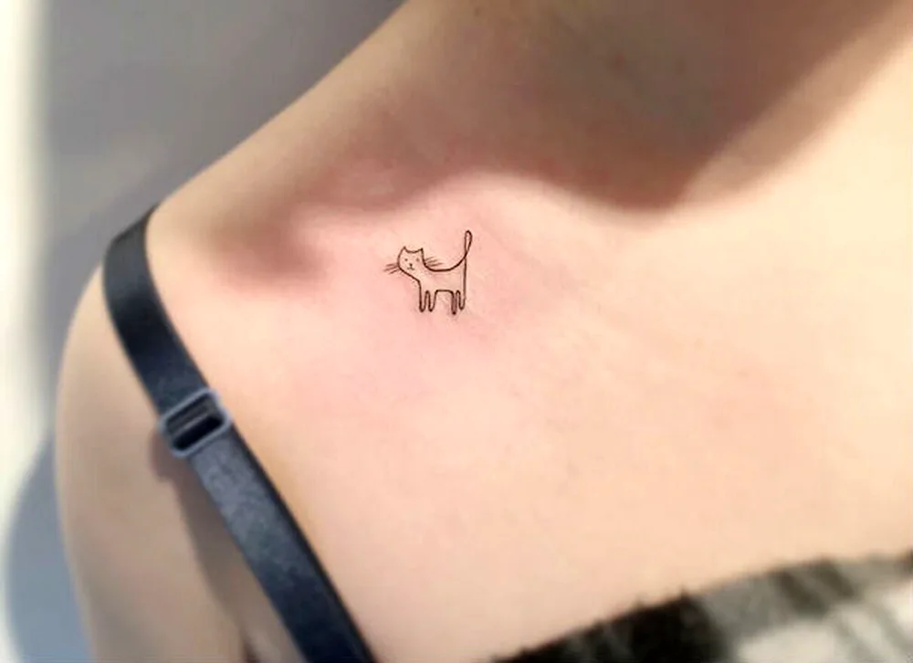 White tattoos on the collarbone