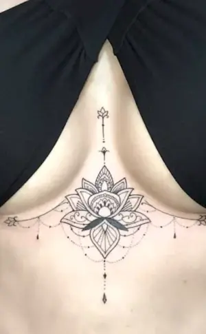 Mini tattoo between breasts