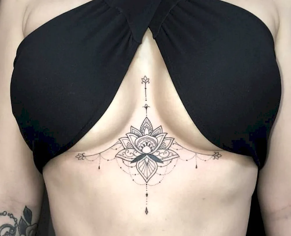 Mini tattoo between breasts